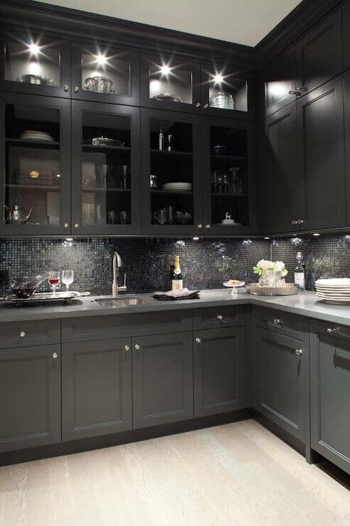 Gray and black kitchen ideas include matching different tones of gray from the light shades on the cabinets and darker or even black on the rest or the other way around. For more kitchen ideas go to thekitchenvibe.com